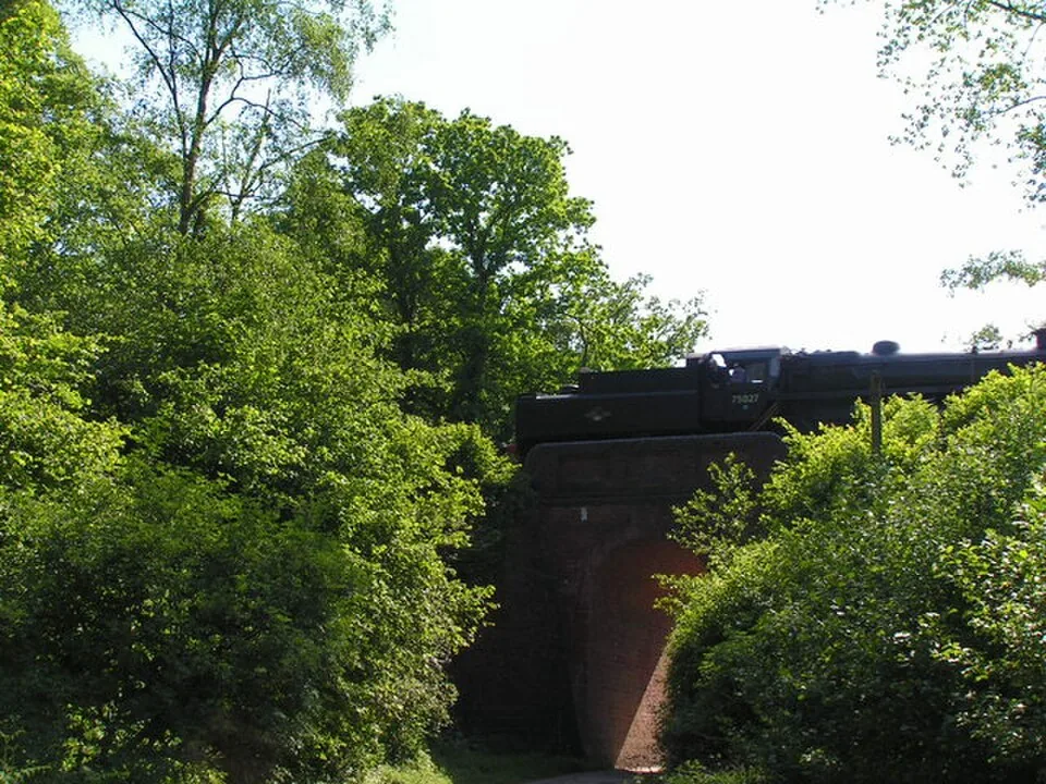 Sheffield Park → Horsted Keynes → Kingscote → East Grinstead: Steam train passing over a bridge
