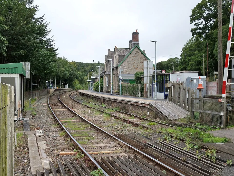 Exeter Central → Barnstaple: Eggesford railway station platforms and buildings, Tarka Line, South Devon - view towards Barnstaple